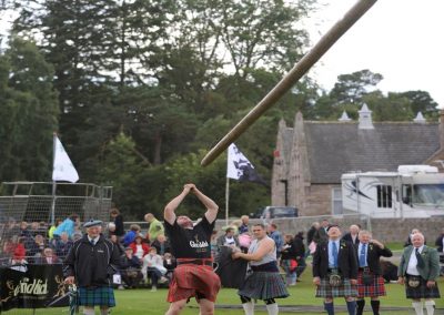 Caber toss at a Highland games