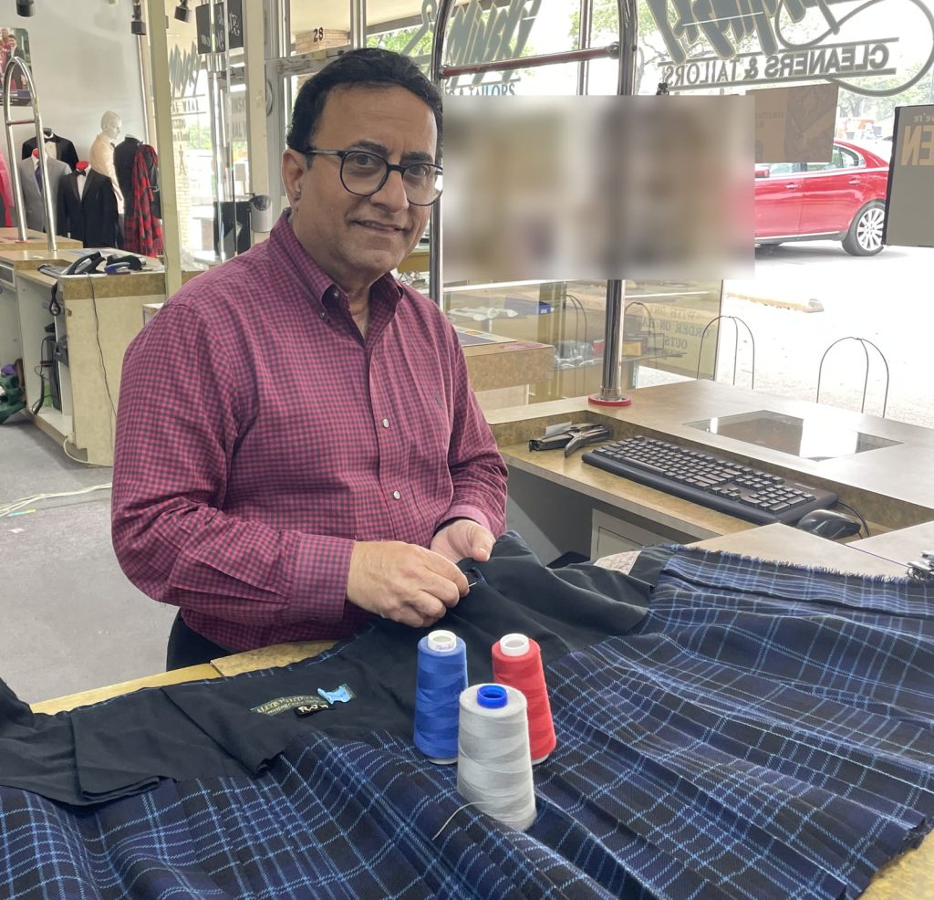 Hand-sewing a kilt alteration at Minsky Cleaners & Tailors in Richardson